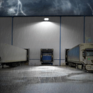 outdoor loading dock area at night illuminated by an overhead light.